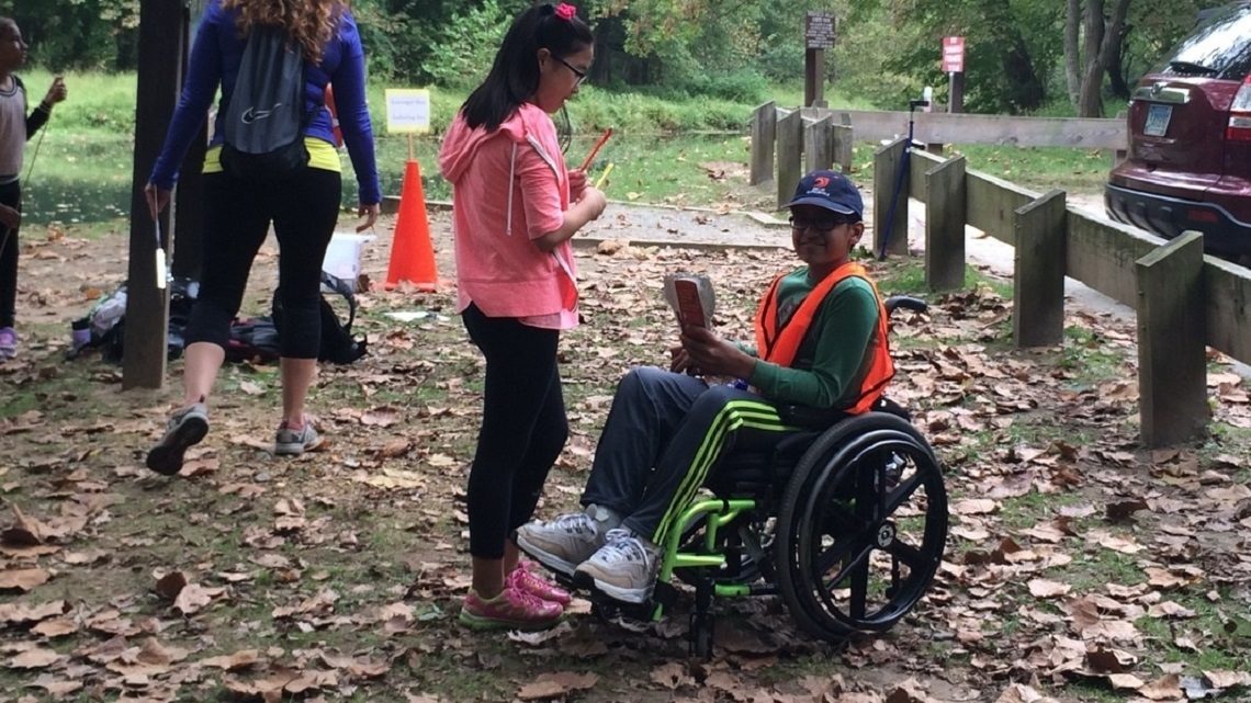 Students chatting on woods path