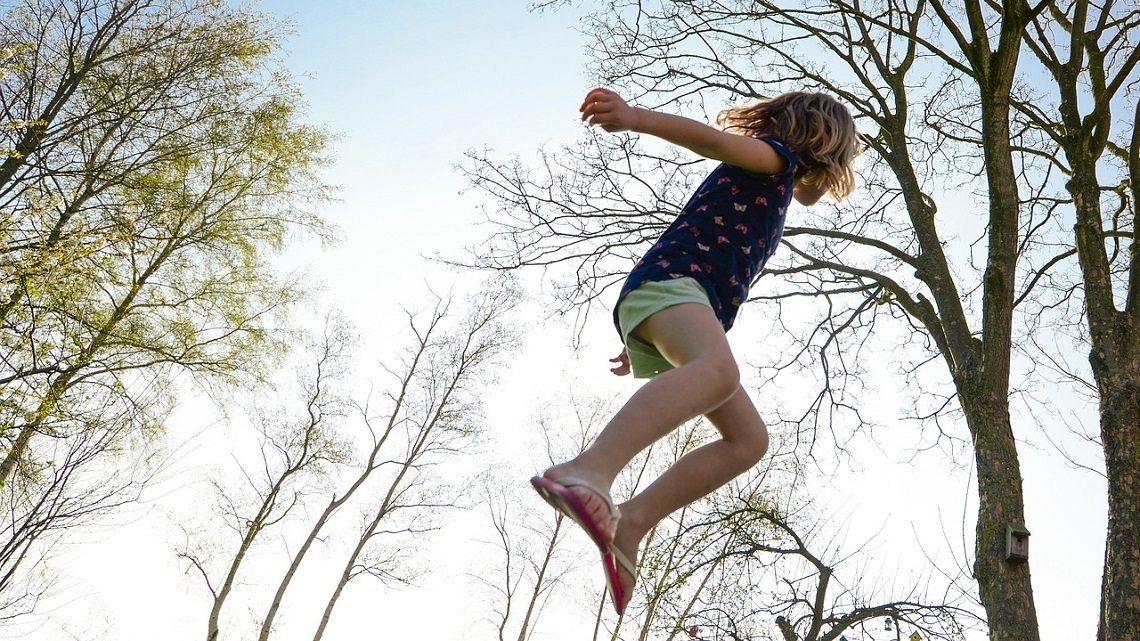 Child jumping through the air