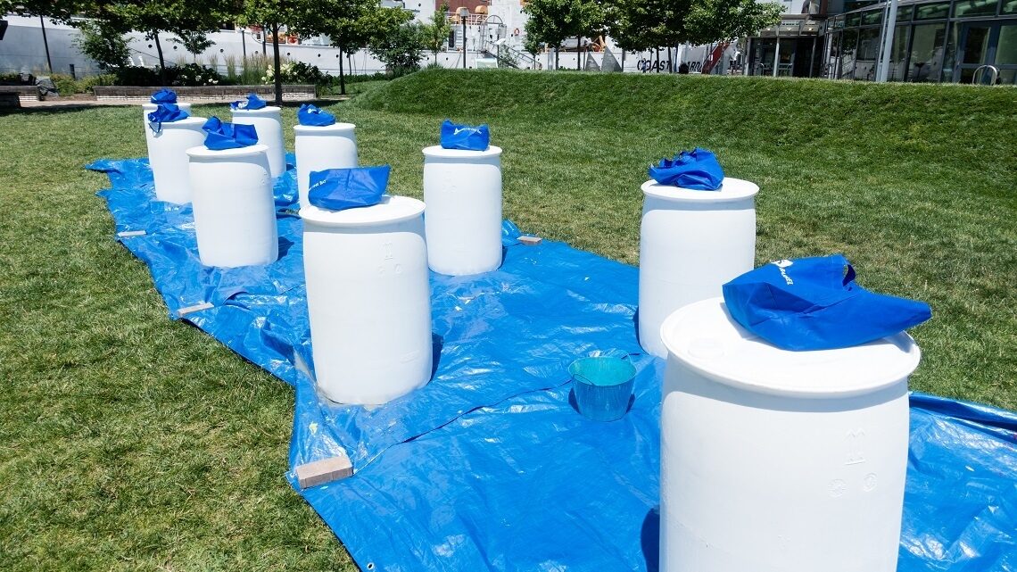 Rain barrels wait to be painted
